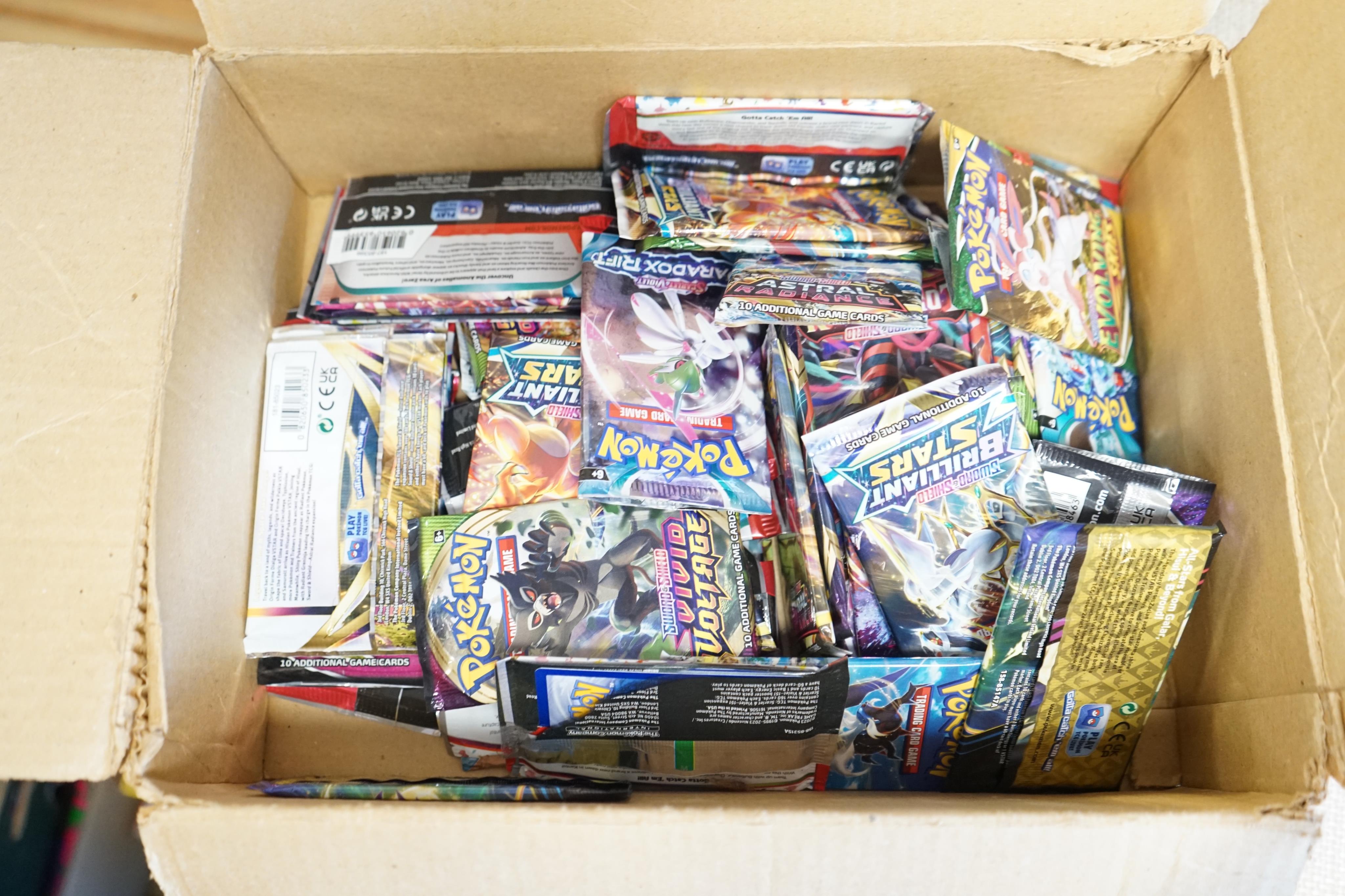 A collection of Pokemon cards and sets, including; approximately sixty 10-card expansion packs (opened), three Elite Trainer Boxes a Pokemon monopoly game, an Annihilape ex box, an Iron Valiant ex box, etc. (opened). Con